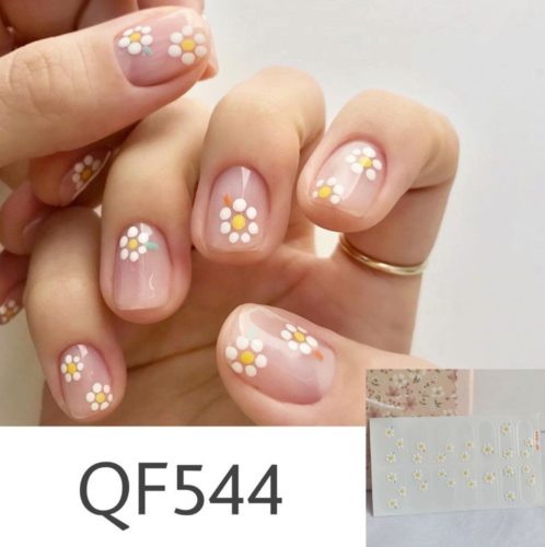 Clear nail polish with minimal white daisies on top - nail art, nail artist flower nail design